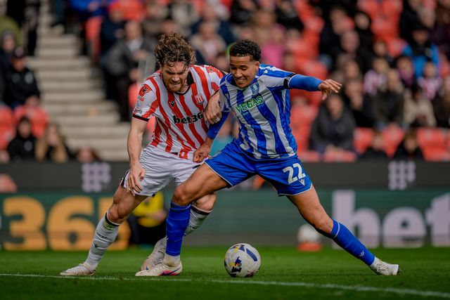 Sam Gallagher of Stoke City battles for the ball  with Gabriel Otegbayo of Sheffield Wednesday during the Sky Bet Championship match Stoke City vs Sheffield Wednesday at Bet365 Stadium, Stoke On Trent, United Kingdom on 03 April 2026

(Photo by Maynard Manyowa/News Images)