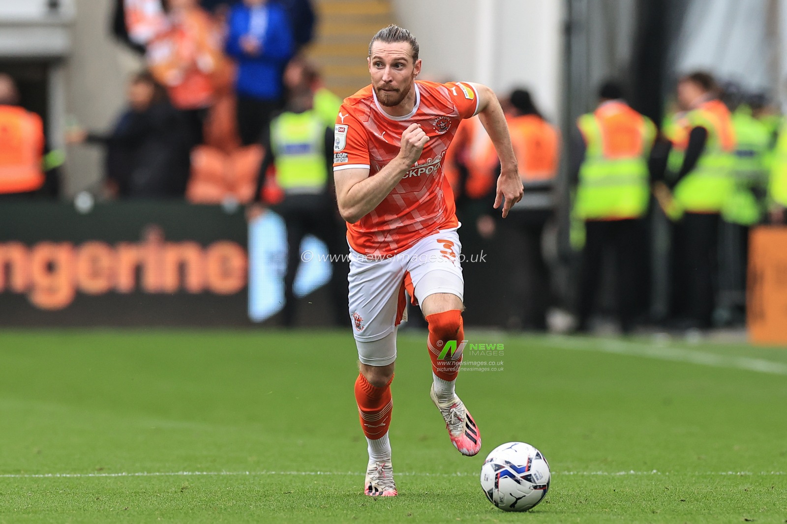 James Husband #3 of Blackpool breaks with the ball