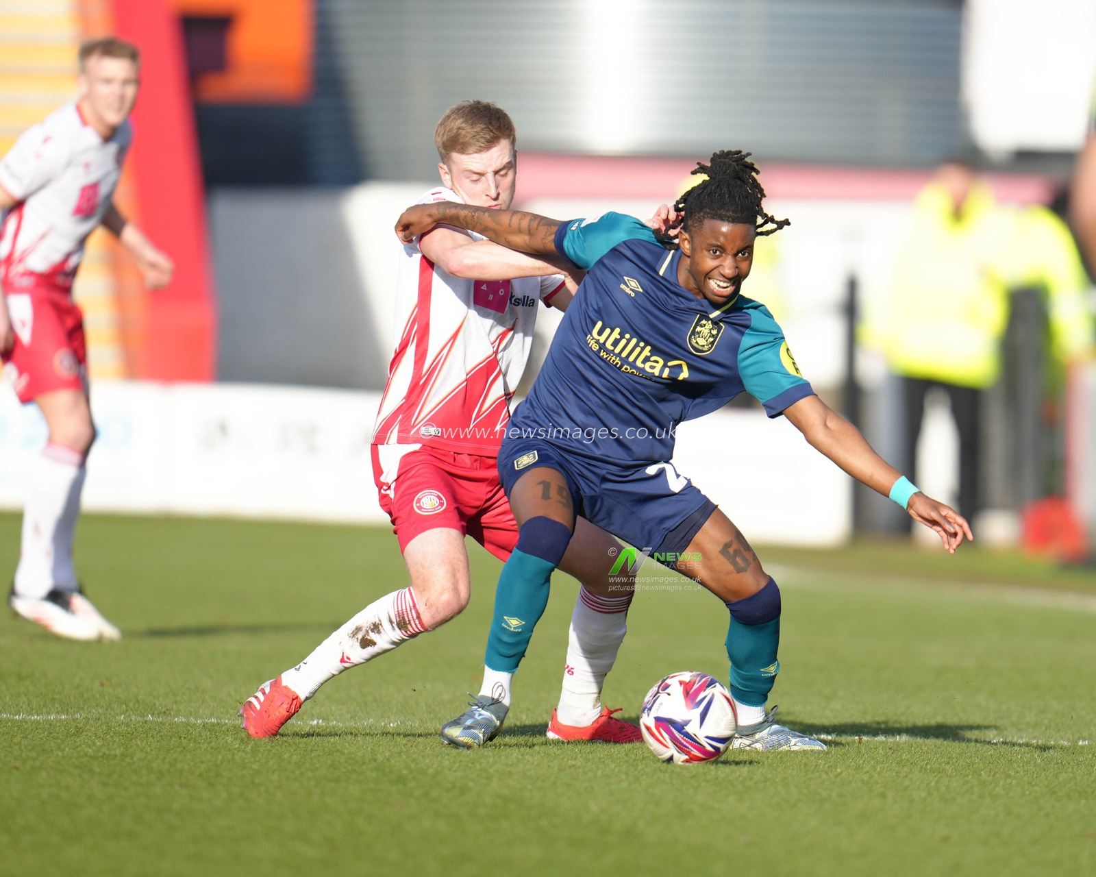 Tawanda Chirewa of Huddersfield Town holds off Harvey White of Stevenage during the Sky Bet League 1 match Stevenage vs Huddersfield Town at Lamex Stadium, Stevenage, United Kingdom, 1st March 2025

(Photo by Harvey Murphy/News Images)