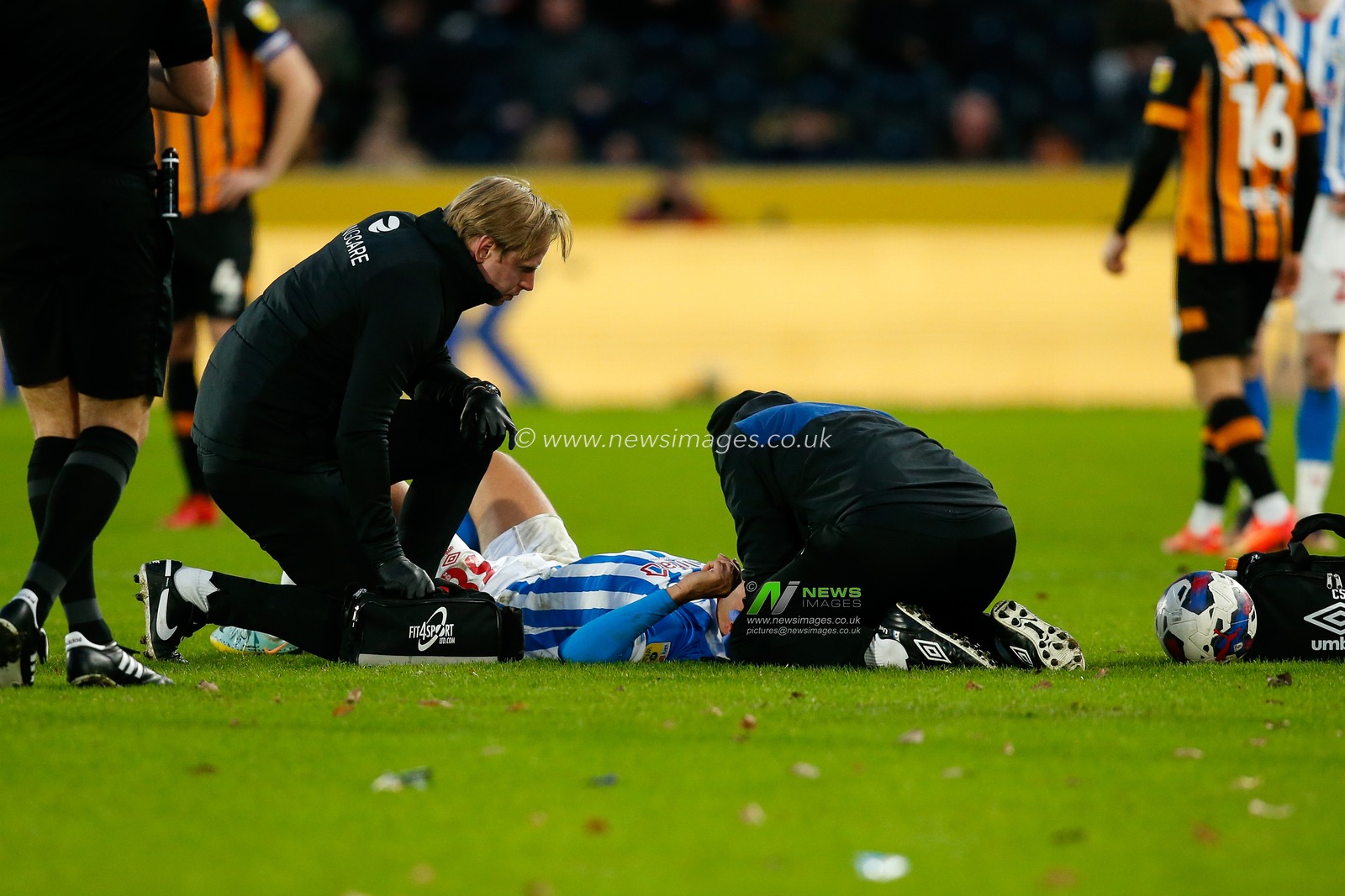 Matthew Lowton #38 of Huddersfield Town receives treatment during the Sky Bet Championship match Hull City vs Huddersfield Town at MKM Stadium, Hull, United Kingdom, 14th January 2023

(Photo by Ben Early/News Images)