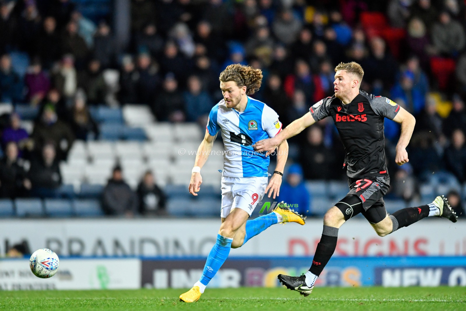 26th February 2020, Ewood Park, Blackburn, England; Sky Bet Championship, Blackburn Rovers v Stoke City : Sam Gallagher (9) of Blackburn Rovers has a foot race with Nathan Collins (37) of Stoke City to the ball