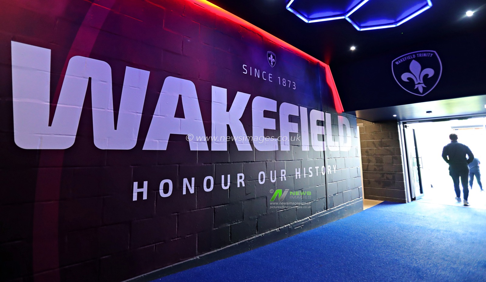 Signage inside the tunnel at the DIY Kitchens Stadium before the Betfred Super League match Wakefield Trinity vs Salford Red Devils at DIY Kitchens Stadium, Wakefield, United Kingdom, 25th May 2025(Photo by Sam Eaden/News Images)