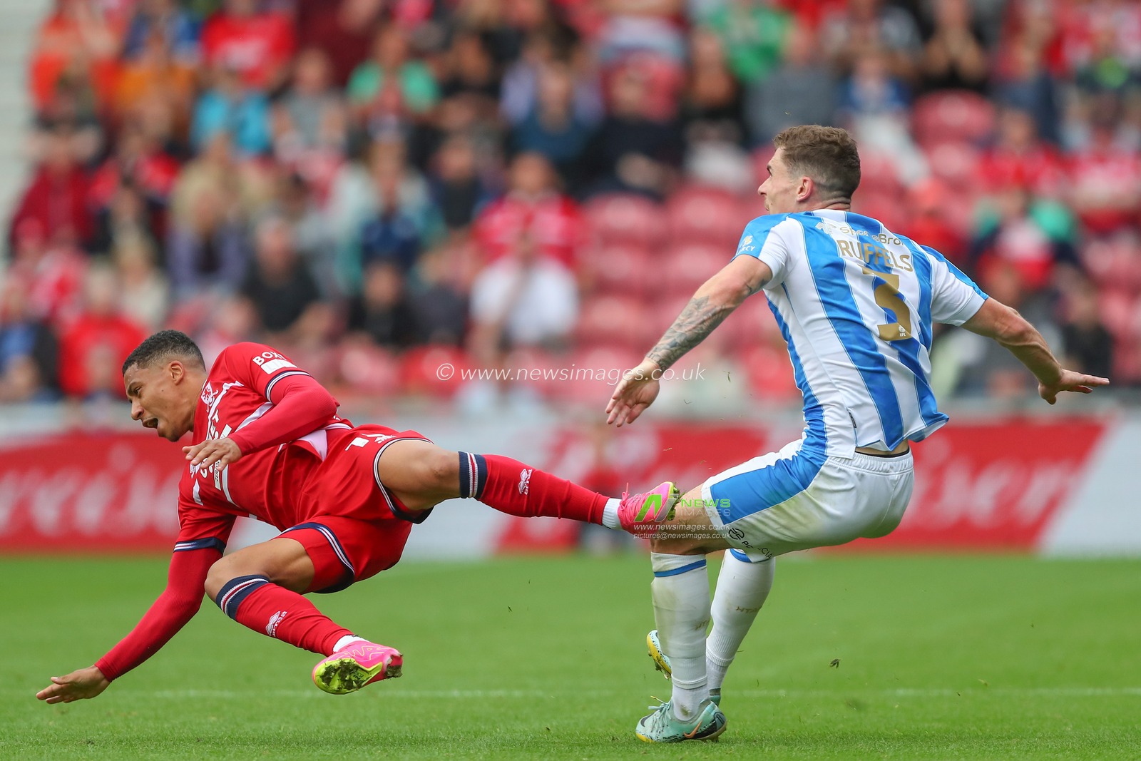 Samuel Silvera #18 of Middlesbrough and Josh Ruffels #3 of Huddersfield Town collide during the Sky Bet Championship match Middlesbrough vs Huddersfield Town at Riverside Stadium, Middlesbrough, United Kingdom, 19th August 2023

(Photo by Gareth Evans/News Images)