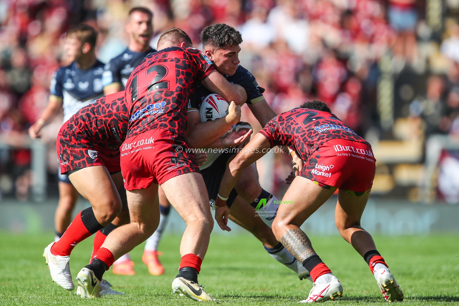 Jack Hughes of Leigh Leopards tackles Zach Jebson of Hull FC during the Betfred Super League Round 21 match Leigh Leopards vs Hull FC at Leigh Sports Village, Leigh, United Kingdom, 11th August 2024

(Photo by Gareth Evans/News Images)