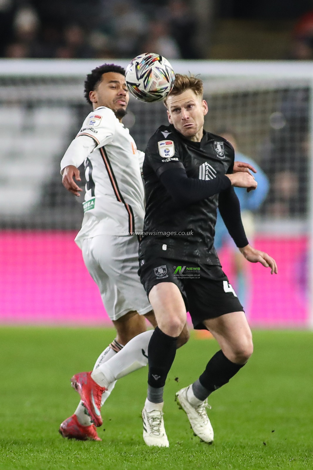Stuart Armstrong of Sheffield Wednesday and Florian Bianchini of Swansea City compete for the ball during the Sky Bet Championship match Swansea City vs Sheffield Wednesday at Swansea.com Stadium, Swansea, United Kingdom, 12th February 2025

(Photo by Andrew Lewis/News Images)