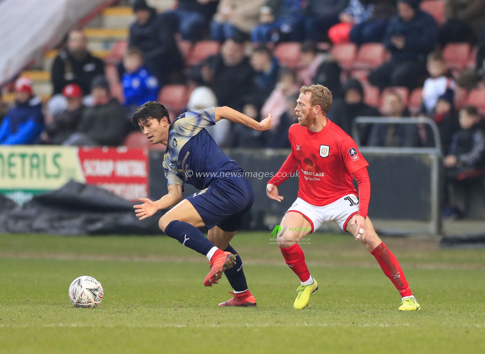5th January 2020, Alexandra Stadium, Crewe, England; Emirates FA Cup, Crewe Alexandra v Barnsley : Kenny Dougall (4) of Barnsley and Paul Green (12) of Crewe Alexandra challenge for the ball

Credit: Conor Molloy/News Images