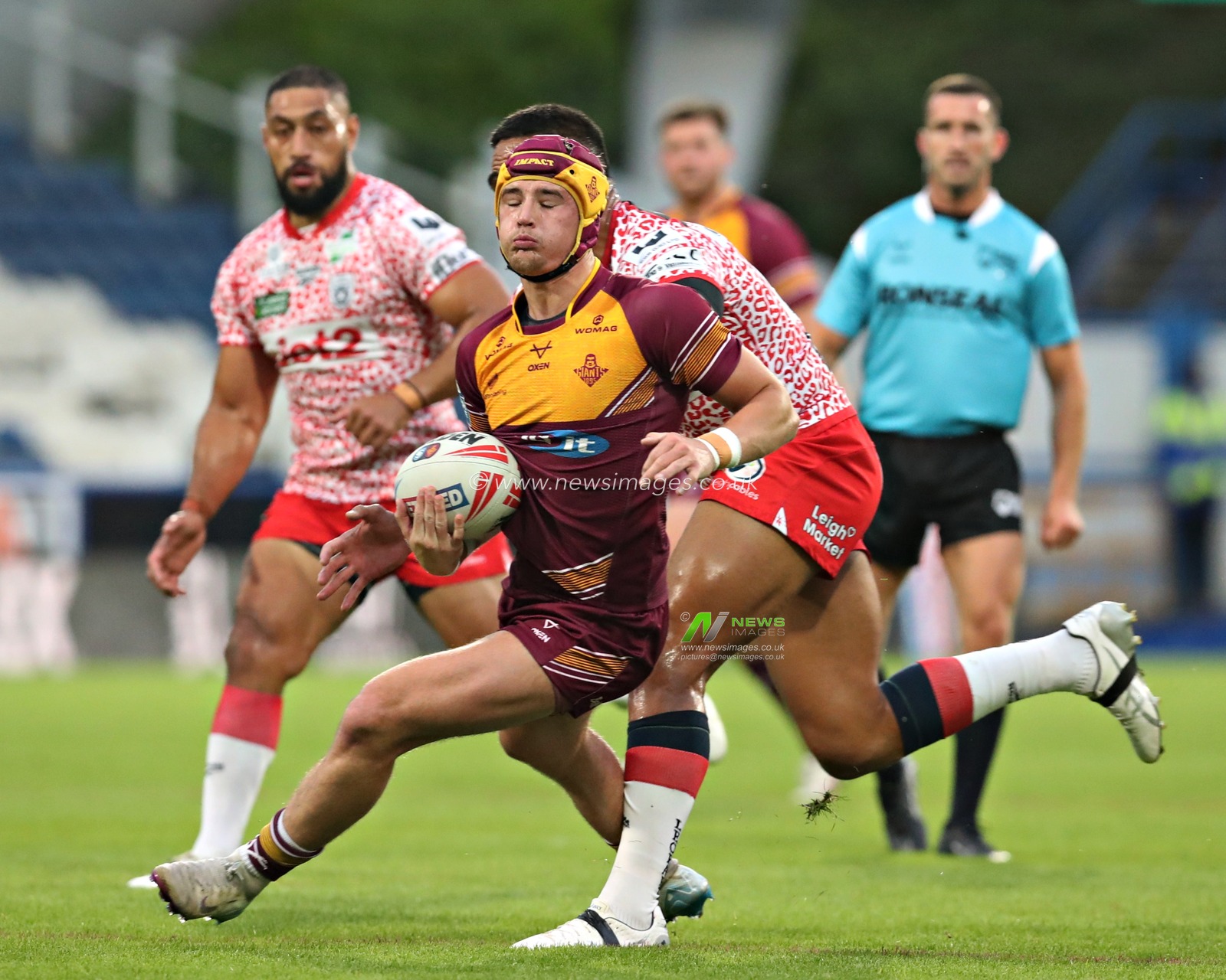 George Flanagan of Huddersfield Giants turns away from Joe Ofahengaue of Leigh Leopards during the Betfred Super League Round 13 match Huddersfield Giants vs Leigh Leopards at John Smith's Stadium, Huddersfield, United Kingdom, 29th May 2025

(Photo by Sam Eaden/News Images)