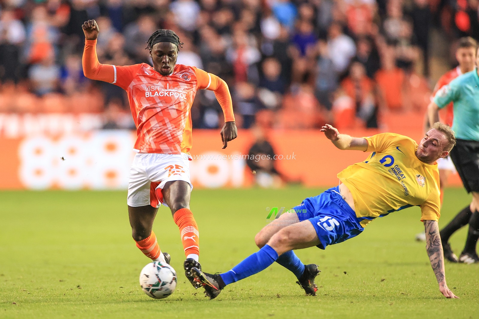 Carl Winchester #15 of Sunderland slides in to win the ball from Cameron Antwi #25 of Blackpool