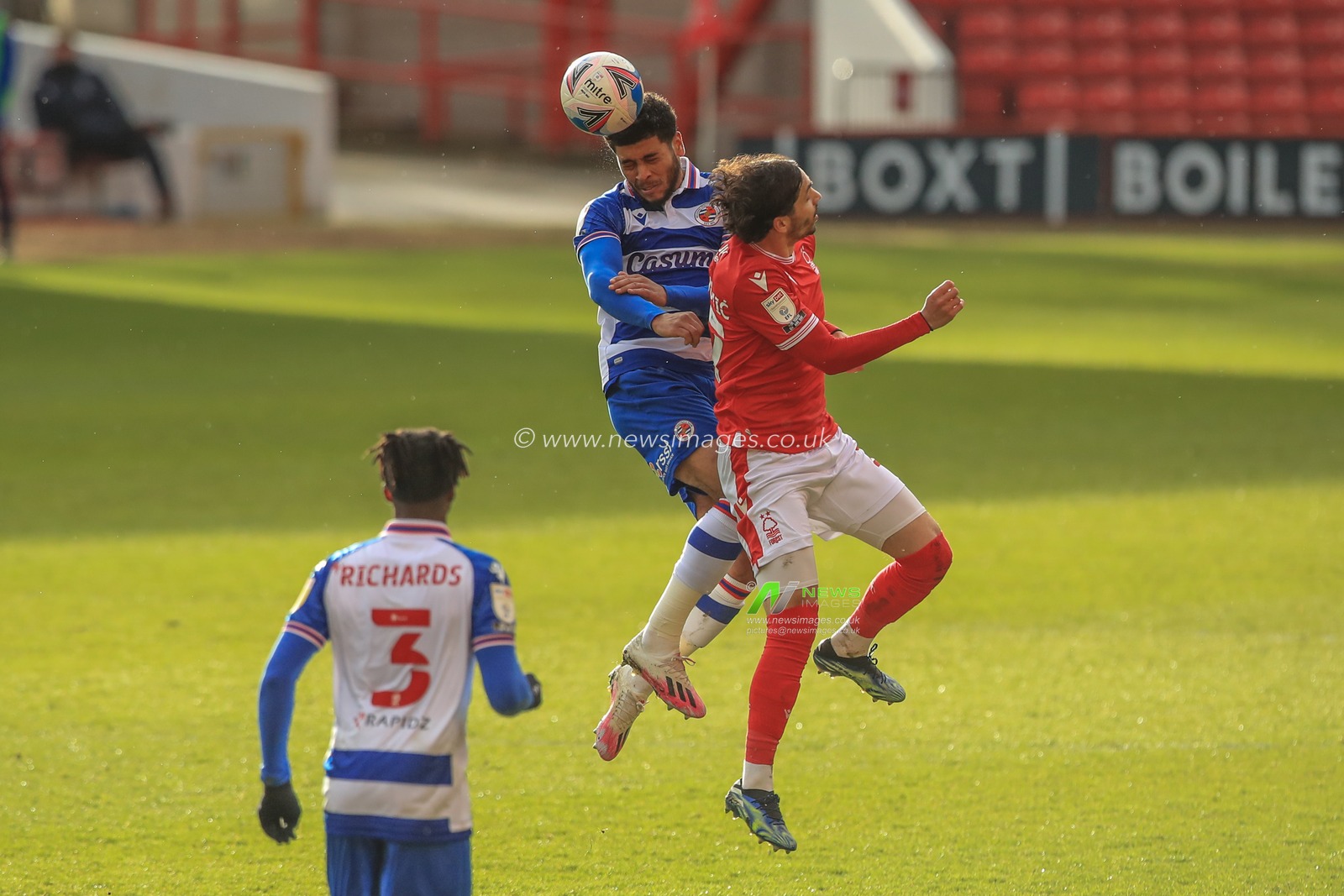 Josh Laurent #28 of Reading wins the high-ball from Filip Krovinovic #27 of Nottingham Forest