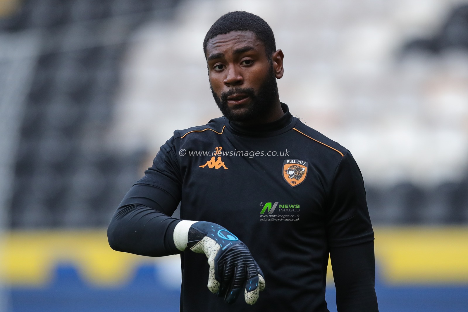 ThimothÃ©e Lo-Tutala #32 of Hull City speaks with goalkeeping coach Barry Richardson during the warm up ahead of the pre match warm up ahead of the Pre-season friendly match Hull City vs Barnsley at MKM Stadium, Hull, United Kingdom, 18th July 2023

(Photo by James Heaton/News Images)