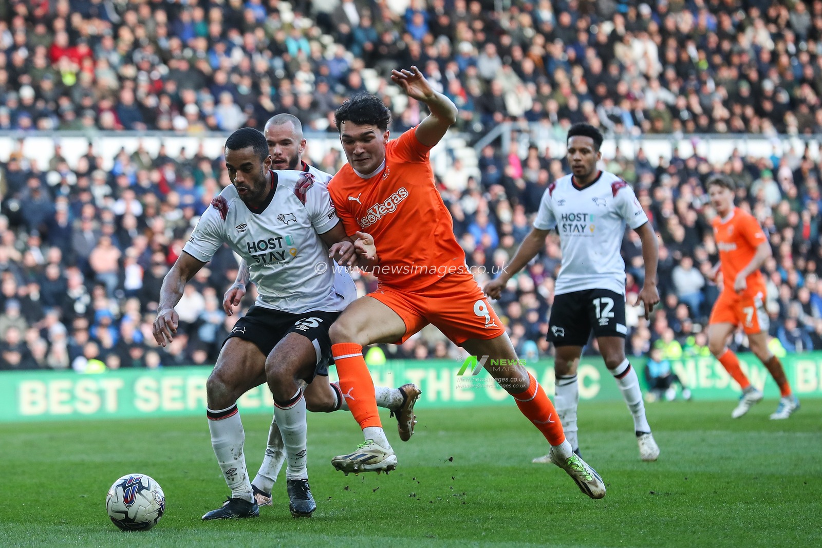 Curtis Nelson of Derby County and Kyle Joseph of Blackpool battle for the ball during the Sky Bet League 1 match Derby County vs Blackpool at Pride Park Stadium, Derby, United Kingdom, 29th March 2024

(Photo by Gareth Evans/News Images)