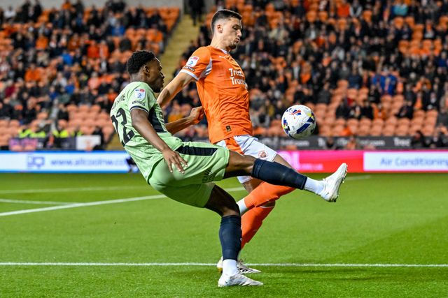 Lamine Fanne of Luton Town  puts over a cross under pressure from Oliver Casey of Blackpoolduring the Sky Bet League 1 match Blackpool vs Luton Town at Bloomfield Road, Blackpool, United Kingdom, 30th September 2025

(Photo by Adam Gee/News Images)