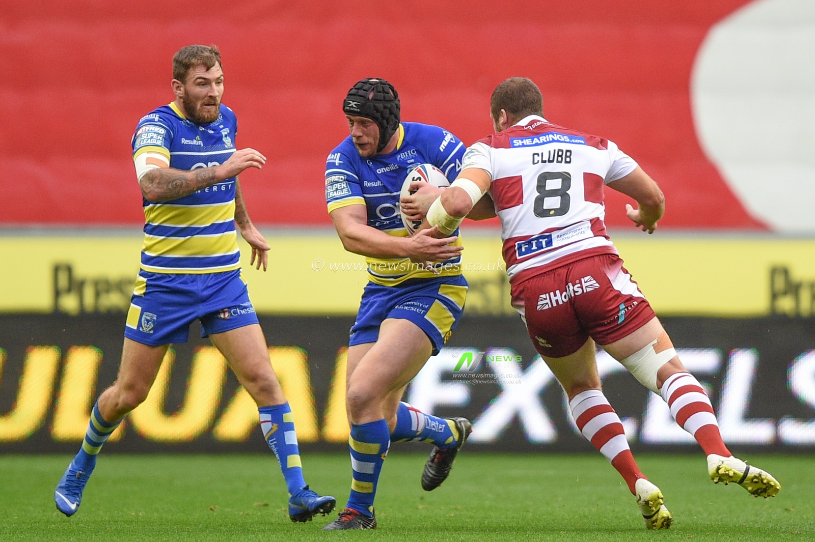 16th August 2019 , DW Stadium, Wigan, England;  Betfred Super League, Round 26, Wigan Warriors vs Warrington Wolves ; Chris Hankinson of Wigan Warriors is tackled by Tony Clubb (8) of Wigan Warriors 

Credit: Richard Long/News Images