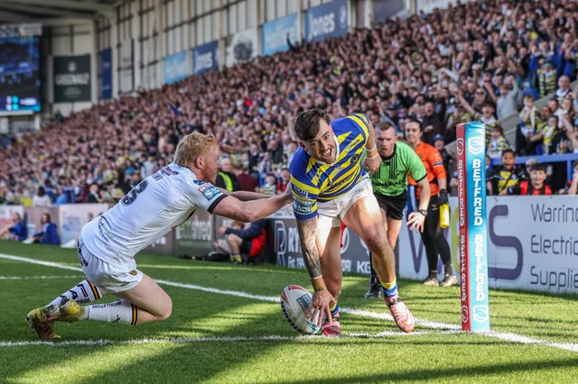 Matty Ashton of Warrington Wolves goes over for a try during the Betfred Super League round 5 match Warrington Wolves vs Castleford Tigers at The Halliwell Jones Stadium, Warrington, United Kingdom on 21 March 2026

(Photo by Alfie Cosgrove/News Images)