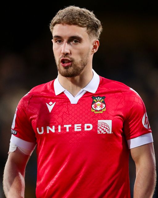 Sam Smith of Wrexham AFC lines up prior to the Sky Bet League 1 match Cambridge United vs Wrexham at Abbey Stadium, Cambridge, United Kingdom, 1st April 2025

(Photo by Izzy Poles/News Images)