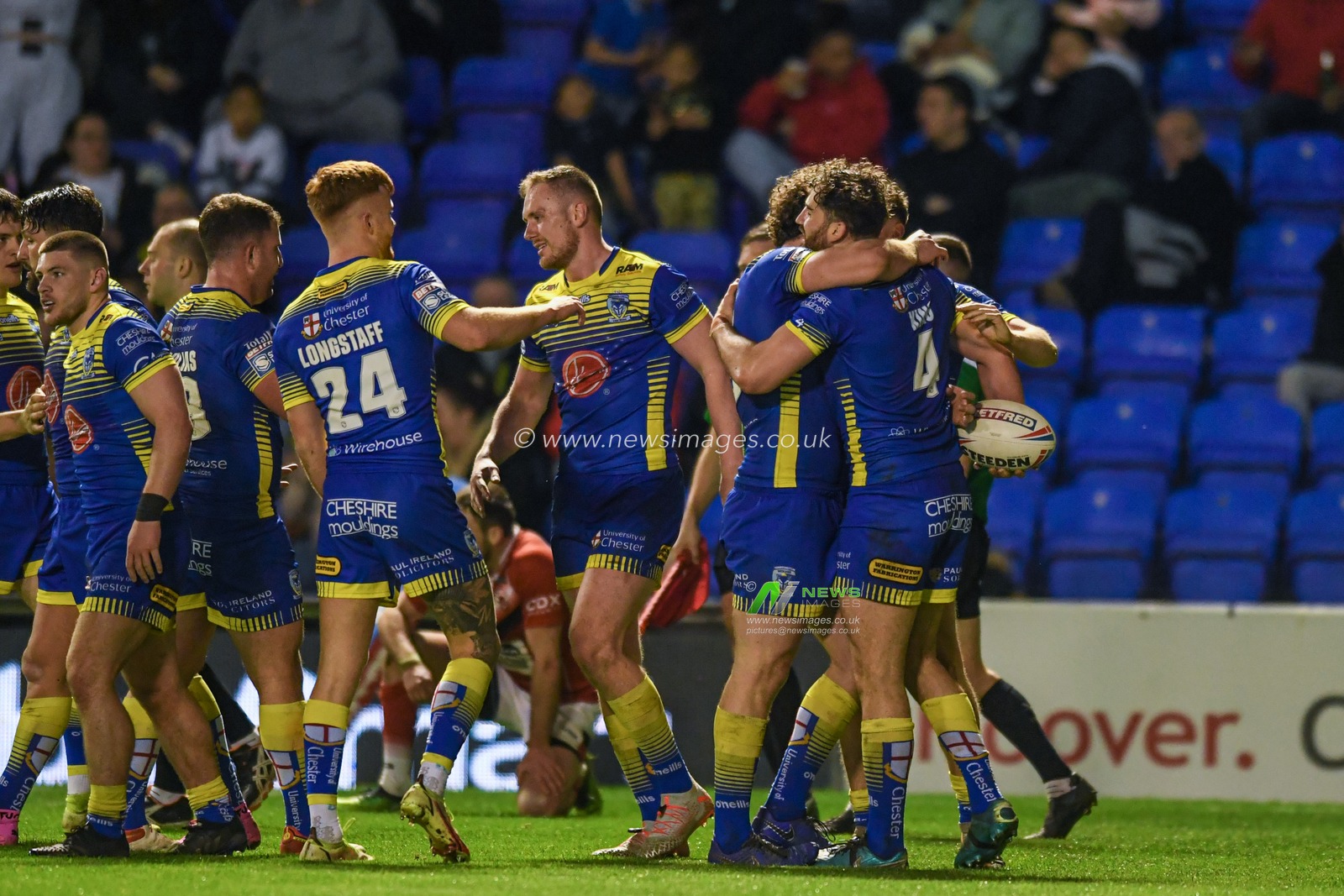 Toby King #4 of Warrington Wolves celebrates scoring a try to make it 30-12