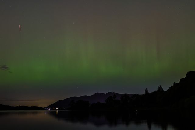 Northern Lights also know as the Aurora Borealis shines over Derwent Water