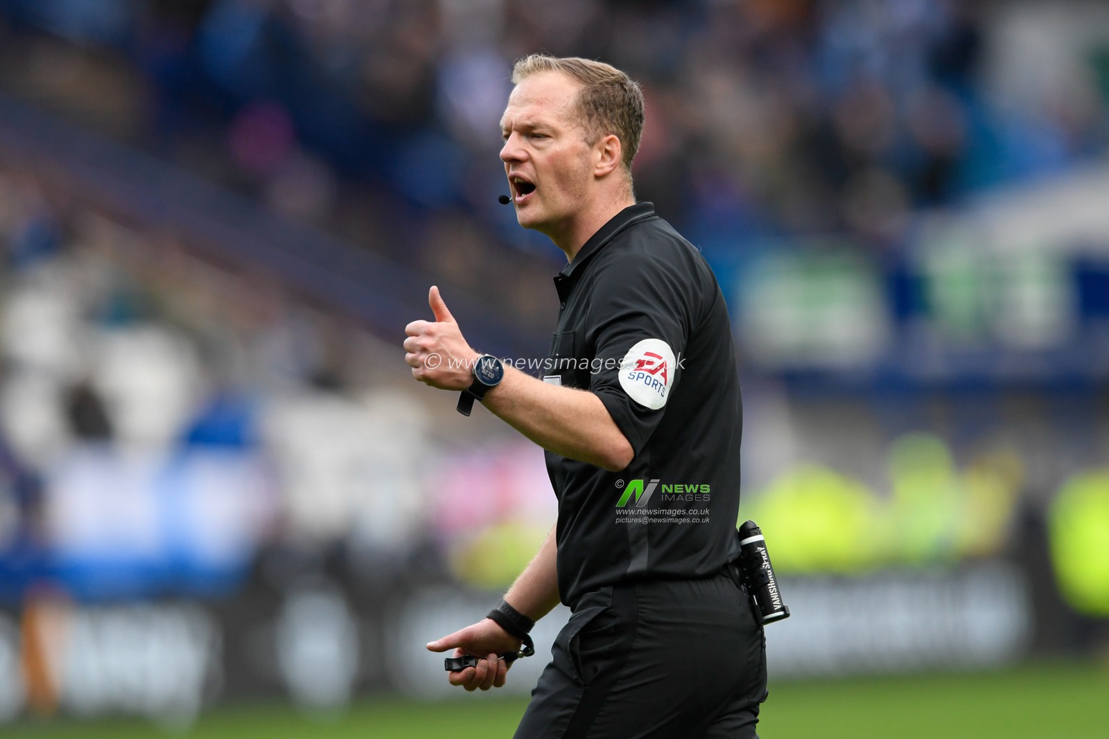 Referee Martin Coy gives a thumbs up during the game