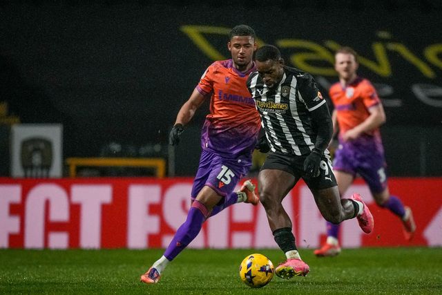 Lee Ndlovu of Notts County controls the ball in the air under challenge from Travis Akomeah of Gillingham during the Sky Bet League 2 match Notts County vs Gillingham at Meadow Lane, Nottingham, United Kingdom, 3rd February 2026

(Photo by Maynard Manyowa/News Images)