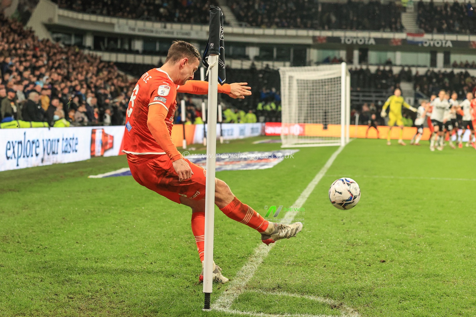 Ryan Wintle #8 of Blackpool takes a corner