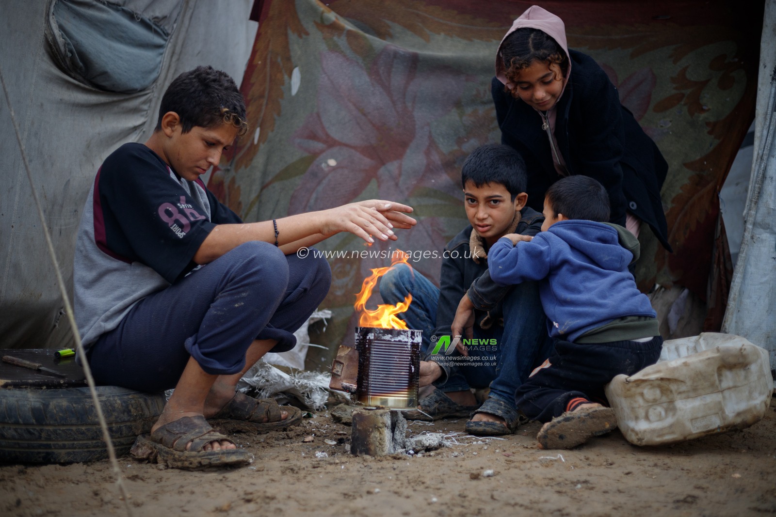 Part of the suffering of the displaced people in the tents during the rain falling in the city of Deir al-Balah in the central Gaza Strip during the 415th day of the war on Gaza.(Photo: Mohammed Skaik/News Images)