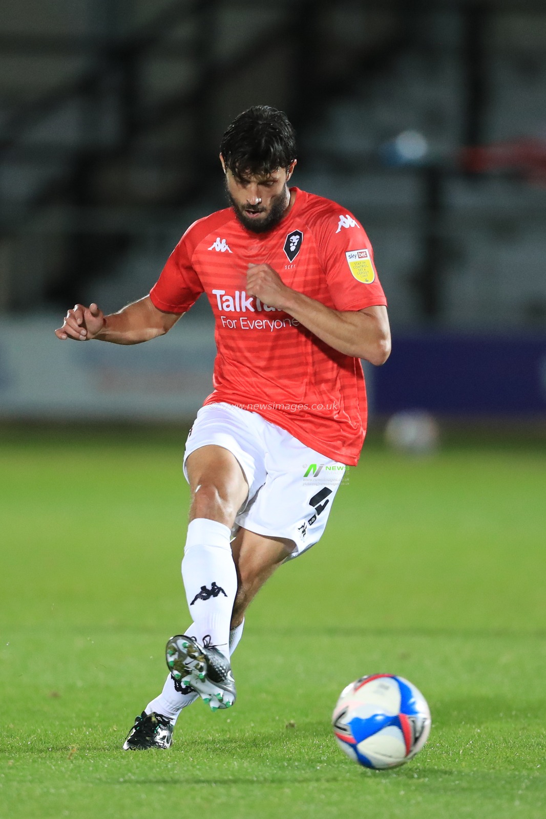 Jason Lowe (4) of Salford City in action during the game