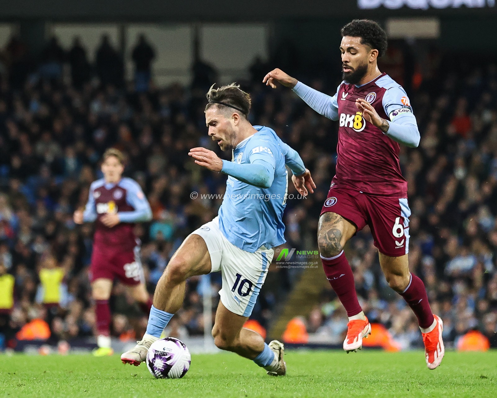Douglas Luiz of Aston Villa fouls Jack Grealish of Manchester City during the Premier League match Manchester City vs Aston Villa at Etihad Stadium, Manchester, United Kingdom, 3rd April 2024

(Photo by Mark Cosgrove/News Images)
