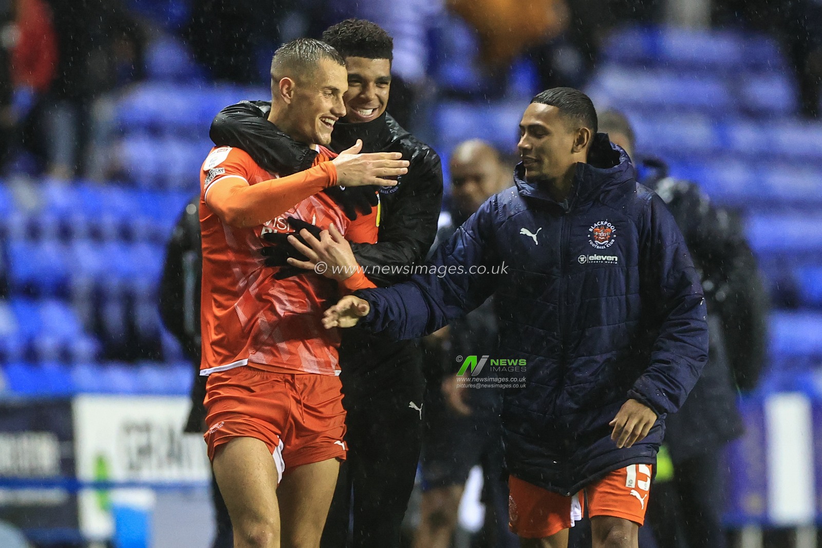 Jerry Yates #9 of Blackpool (L) Tyreece John-Jules #28 of Blackpool (C) and Demetri Mitchell #15 Of Blackpool (R) celebrate their 2-3 win