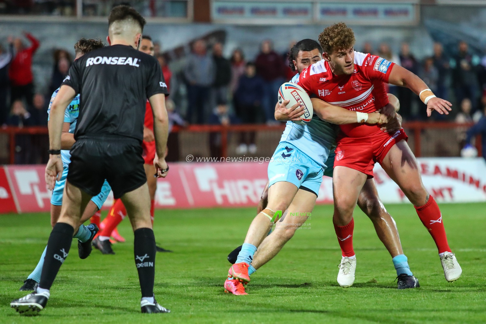 George Lawler (15) of Hull KR is tackled short of the try line