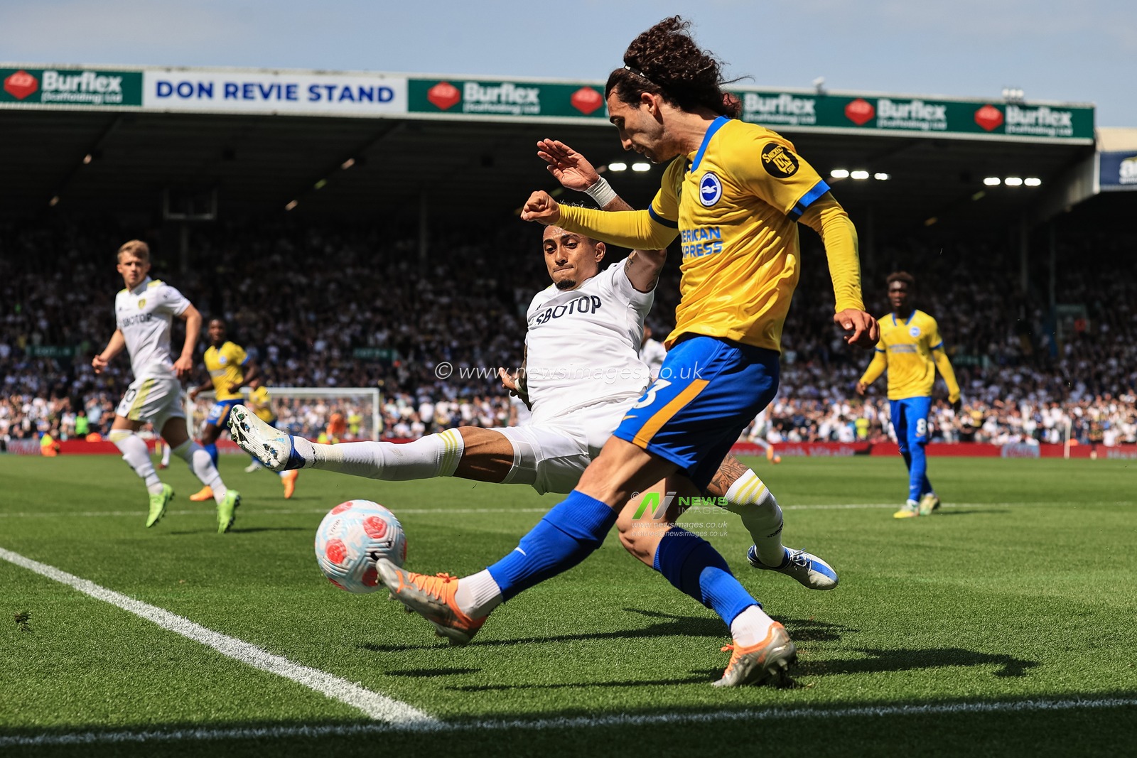 Marc Cucurella #3 of Brighton & Hove Albion clears the ball under pressure from Raphinha #10 of Leeds United