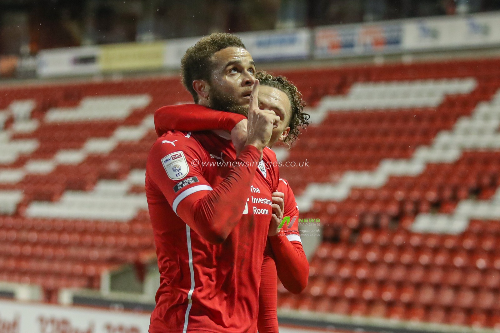 Carlton Morris #14 of Barnsley celebrates his goal to make it 1-0 with Jordan Williams #2 of Barnsley