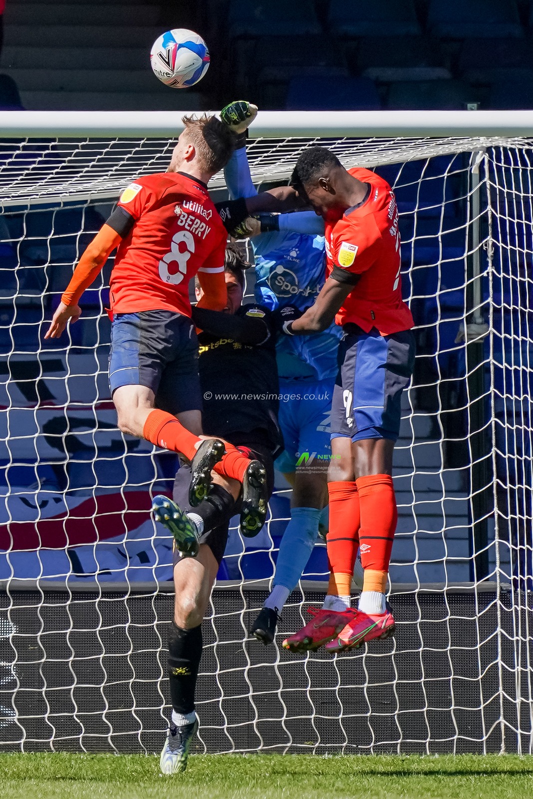 Luke Berry #8 of Luton Town battles with Daniel Bachmann #26 of Watford