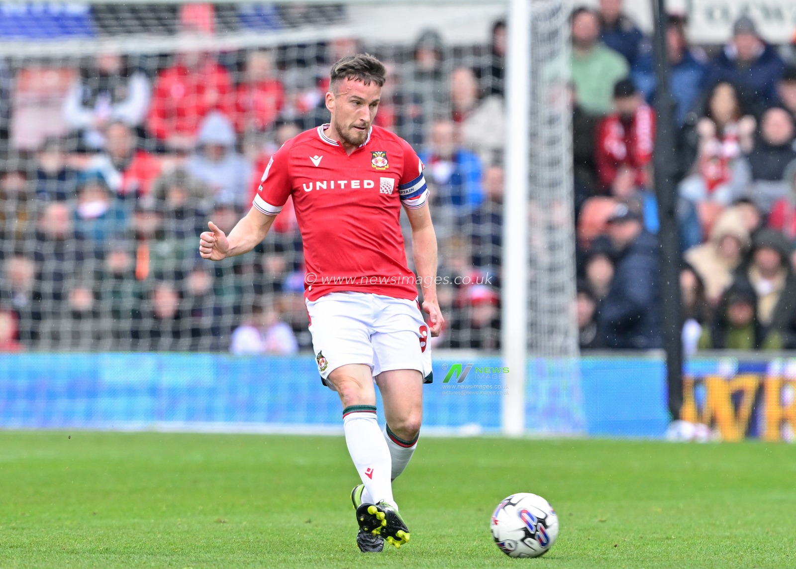 Luke Young of Wrexham passes the ball, during the Sky Bet League 2 match Wrexham vs Stockport County at SToK Cae Ras, Wrexham, United Kingdom, 27th April 2024

(Photo by Cody Froggatt/News Images)