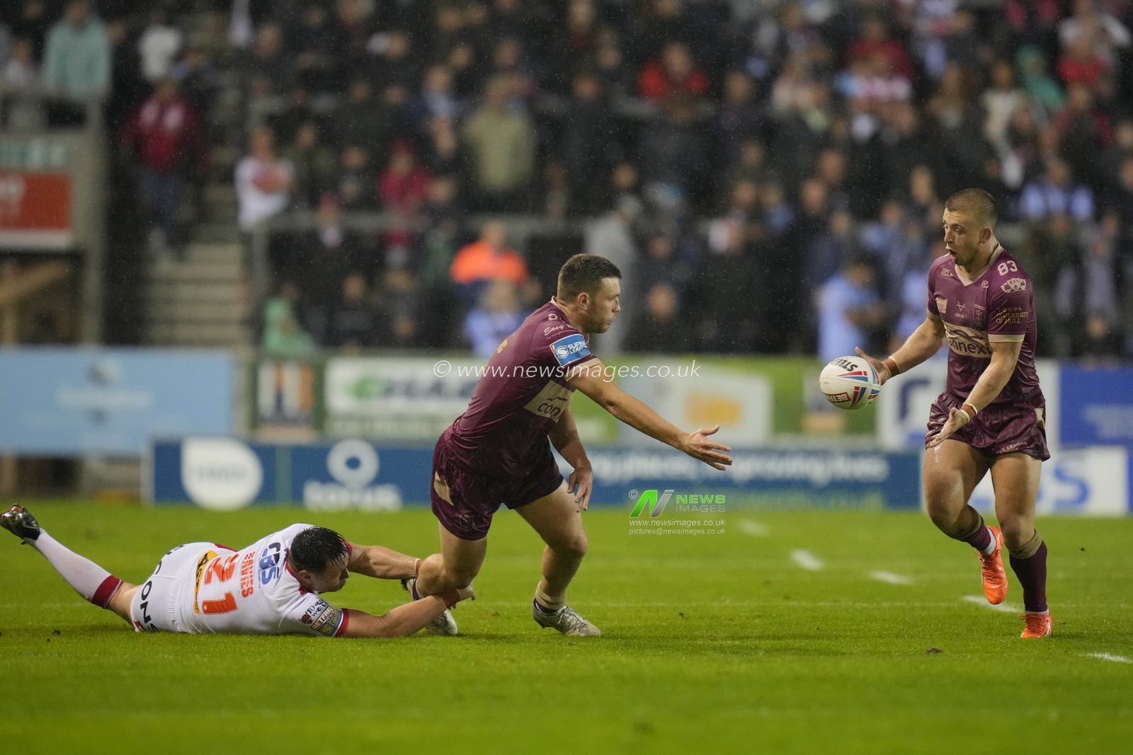 Tom Opacic #3 of Hull KR offloads the ball to Mikey Lewis #20 of Hull KR during the Betfred Super League Round 22 match St Helens vs Hull KR at Totally Wicked Stadium, St Helens, United Kingdom, 18th August 2023

(Photo by Steve Flynn/News Images)