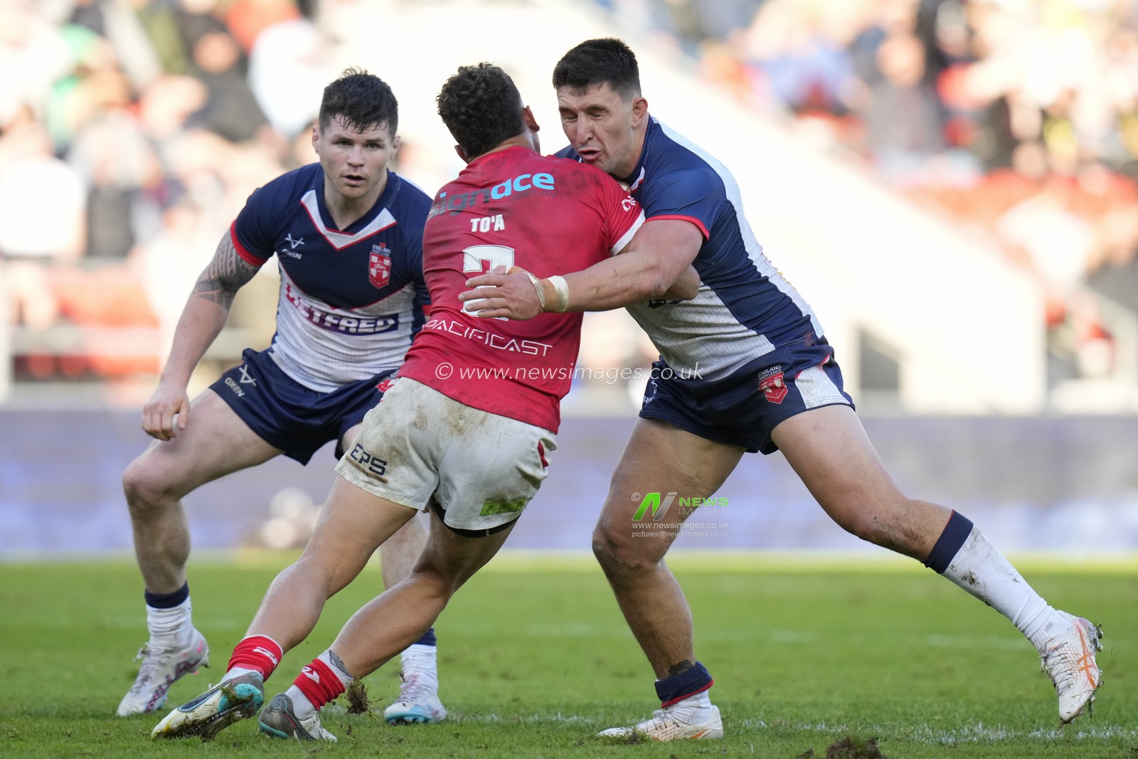 Victor Radley #13 of England tackles Starford To'a #2 of Tonga during the Rugby League International match England vs Tonga at Totally Wicked Stadium, St Helens, United Kingdom, 22nd October 2023

(Photo by Steve Flynn/News Images)