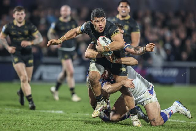 John Asiata of Hull FC is tackled by Caleb Hamlin-Uele of Wakefield Trinity during the Betfred Super League Round 5 match Wakefield Trinity vs Hull FC at DIY Kitchens Stadium, Wakefield, United Kingdom, 21st March 2025

(Photo by Alfie Cosgrove/News Images)