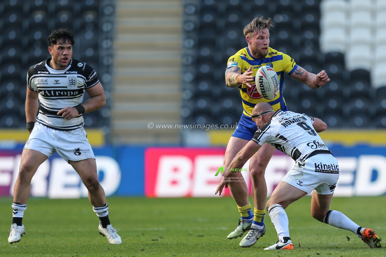 Mike Cooper (10) of Warrington Wolves releases the ball before being tackled