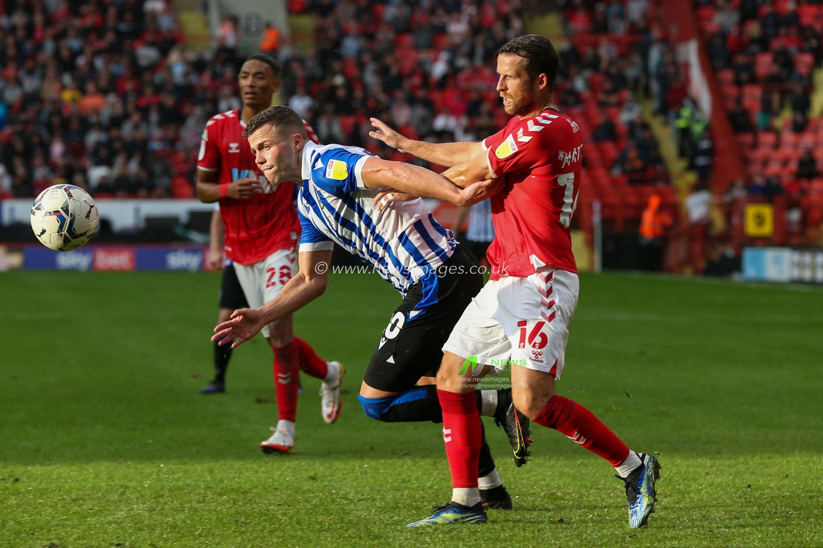 Florian Kamberi  #20 of Sheffield Wednesday challenges Adam Matthews #16 of Charlton Athletic for the ball