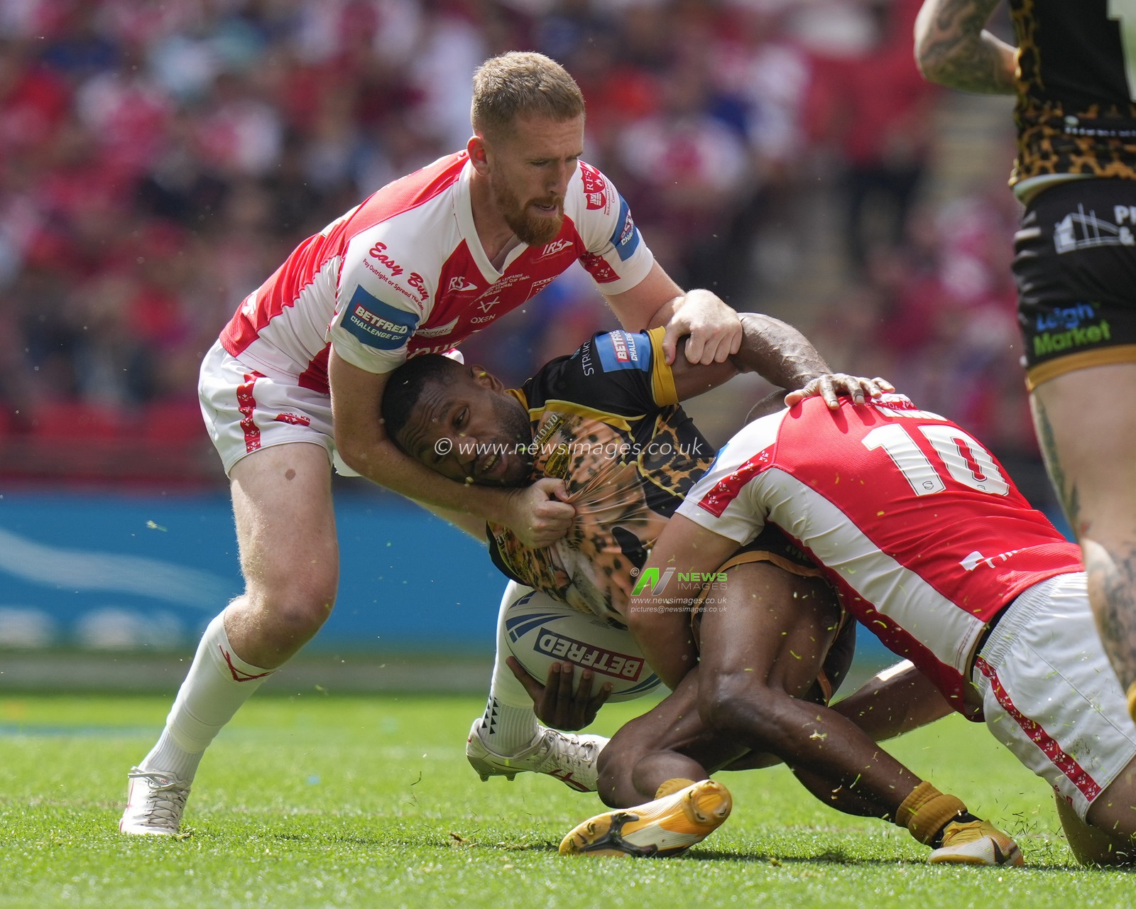 George King #10 of Hull KR  and Rowan Milnes #21 of Hull KR tackle Edwin Ipape #9 of Leigh Leopards during the Betfred Challenge Cup match Hull KR vs Leigh Leopards at Wembley Stadium, London, United Kingdom, 12th August 2023

(Photo by Steve Flynn/News Images)