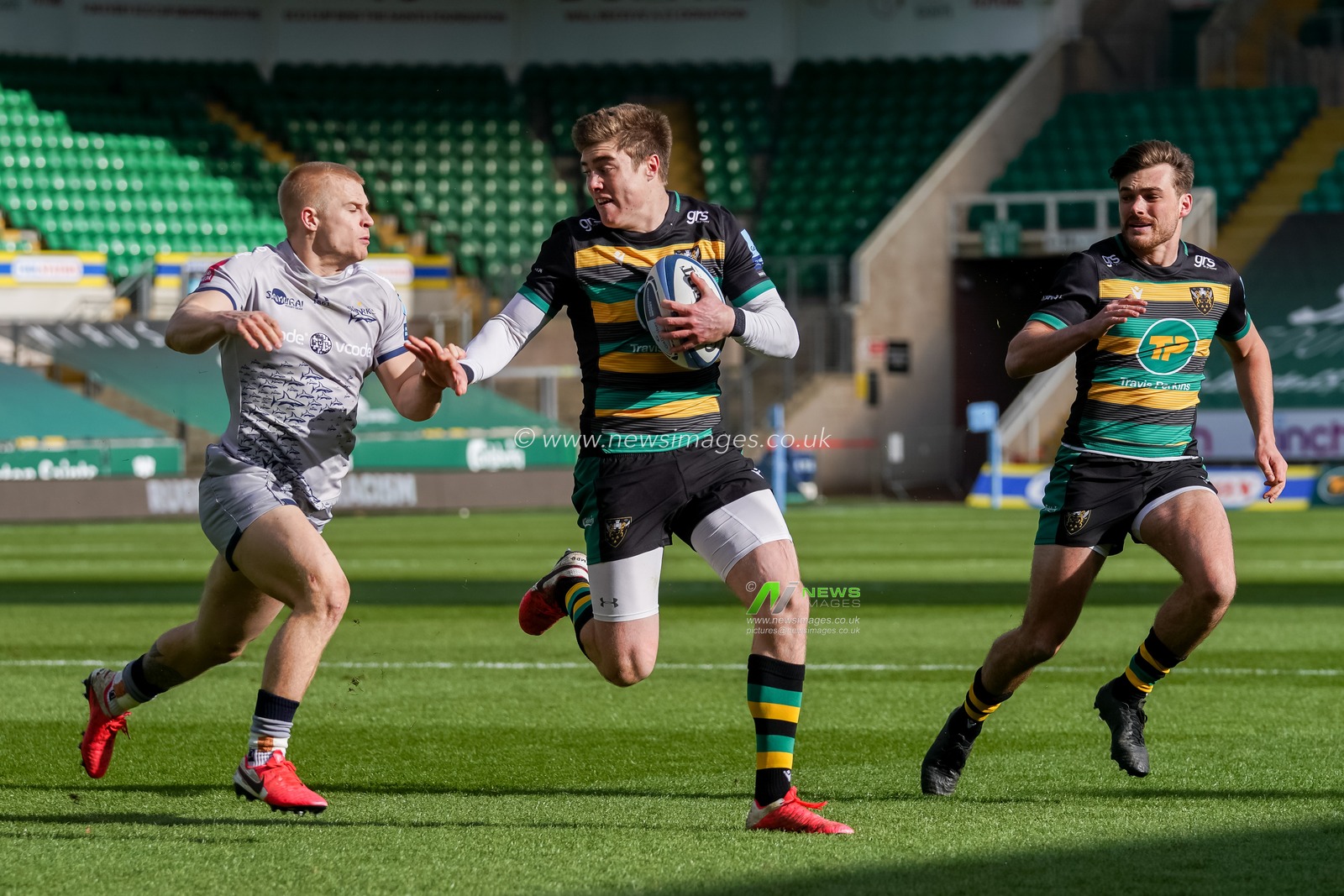 Teimana Harrison #8 of Northampton Saints scores a try