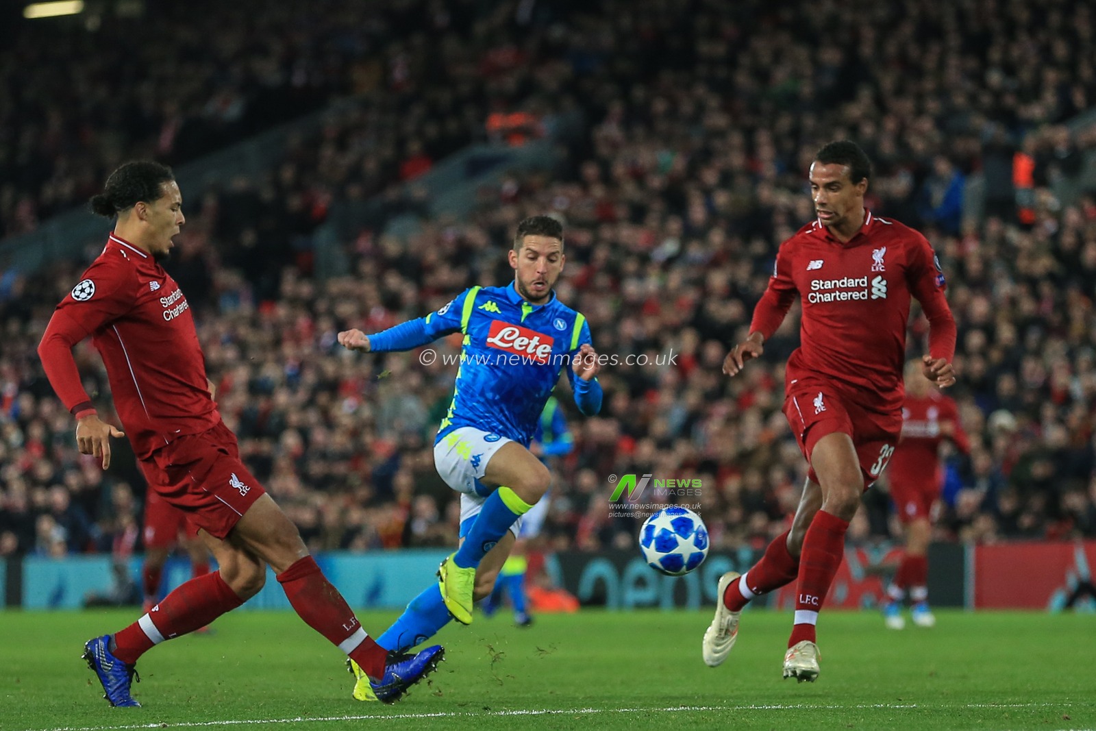 11th December 2018, Anfield, Liverpool, England; UEFA Champions League, Liverpool v Napoli ; Virgil van Dijk (04) of Liverpool clears the ball 


  Credit: Mark Cosgrove/News Images