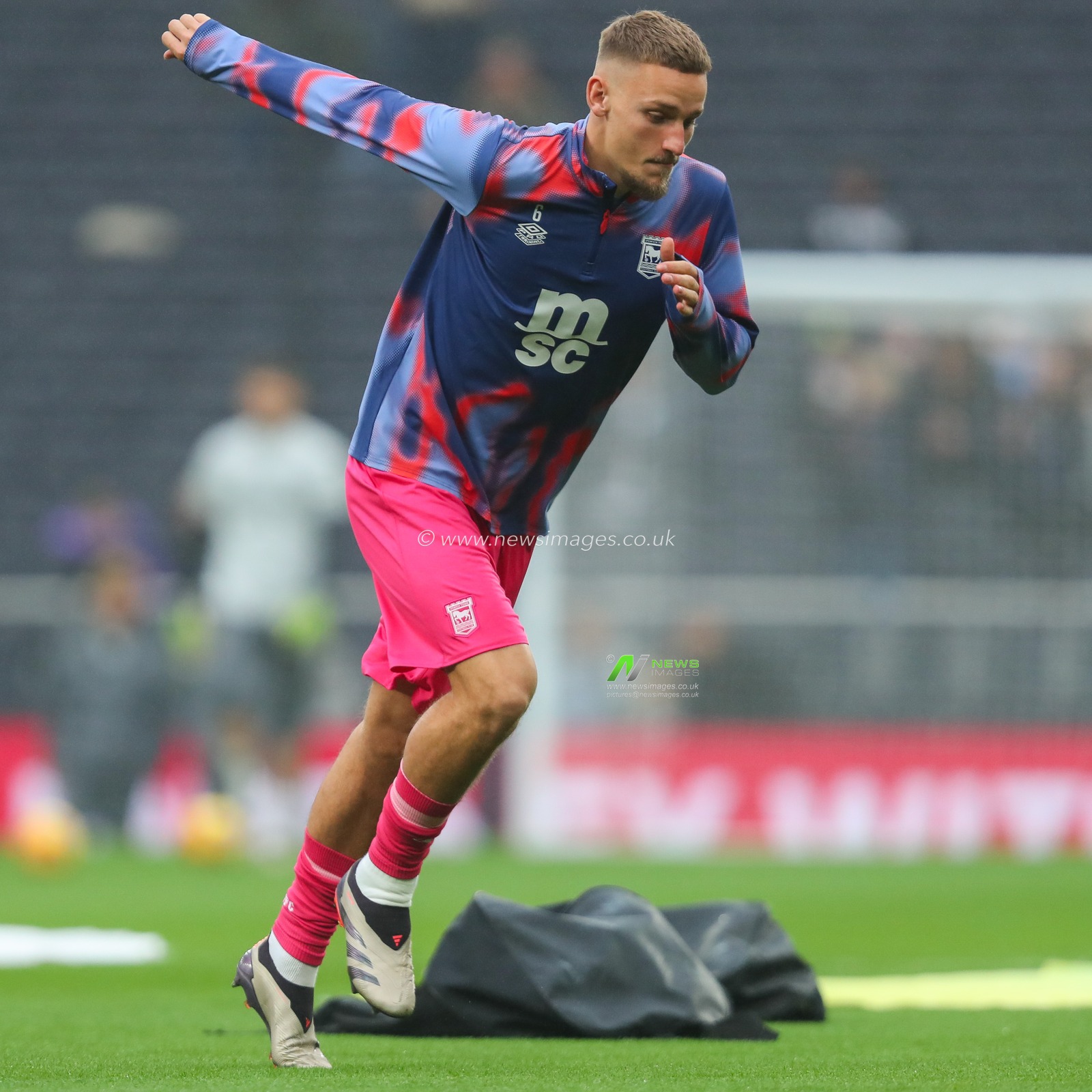 Luke Woolfenden of Ipswich Town warms up prior to the Premier League match Tottenham Hotspur vs Ipswich Town at Tottenham Hotspur Stadium, London, United Kingdom, 10th November 2024

(Photo by Izzy Poles/News Images)