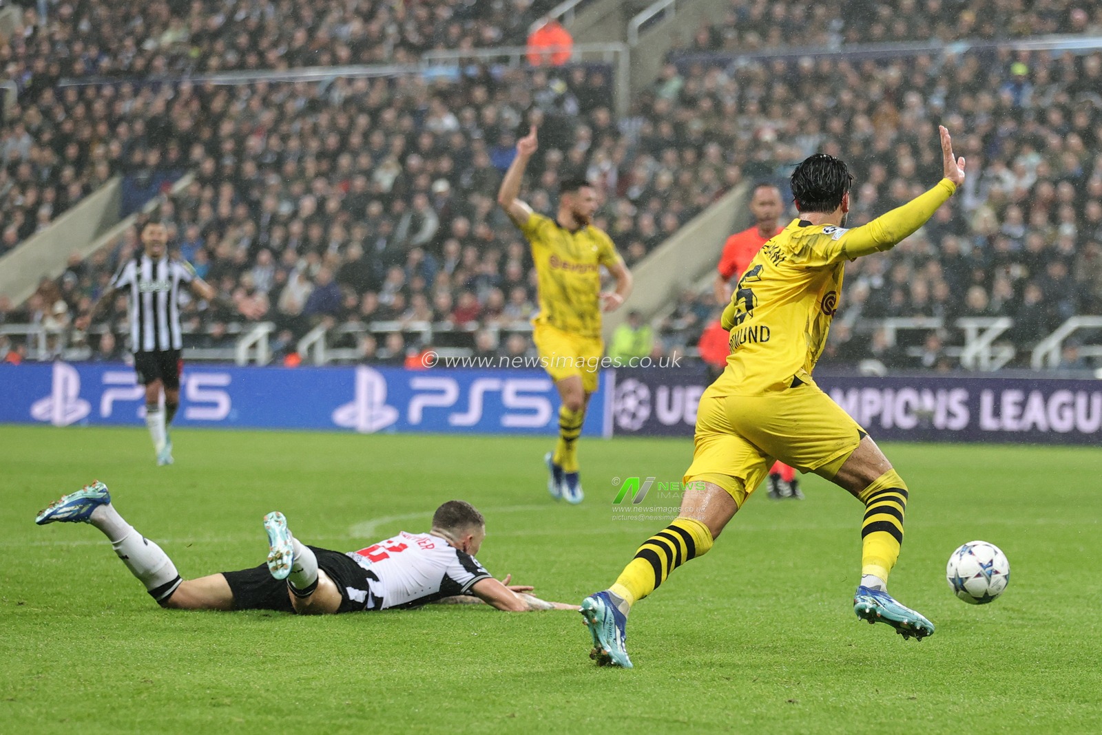 Ramy Bensebaini #5 of Borussia Dortmund reacts after Kieran Trippier #2 of Newcastle United goes down in the penalty area during the UEFA Champions League match Newcastle United vs Borussia Dortmund at St. James's Park, Newcastle, United Kingdom, 25th October 2023

(Photo by Mark Cosgrove/News Images)