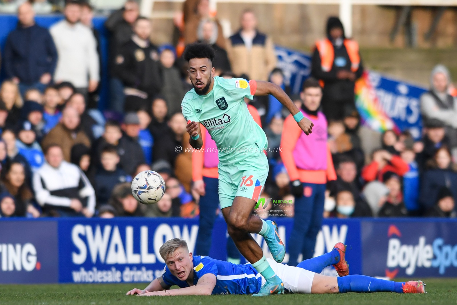 Sorba Thomas #16 of Huddersfield Town starts an attacking move