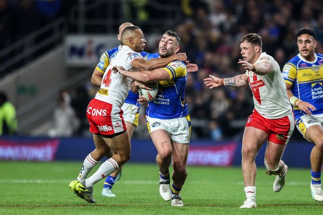 Moses Mbye of St. Helens pulls Jake Connor of Leeds Rhinos to the floor conceding a penalty during the Betfred Super League play-off Eliminator 1 match Leeds Rhinos vs St Helens at Headingley Stadium, Leeds, United Kingdom, 27th September 2025

(Photo by Alfie Cosgrove/News Images)