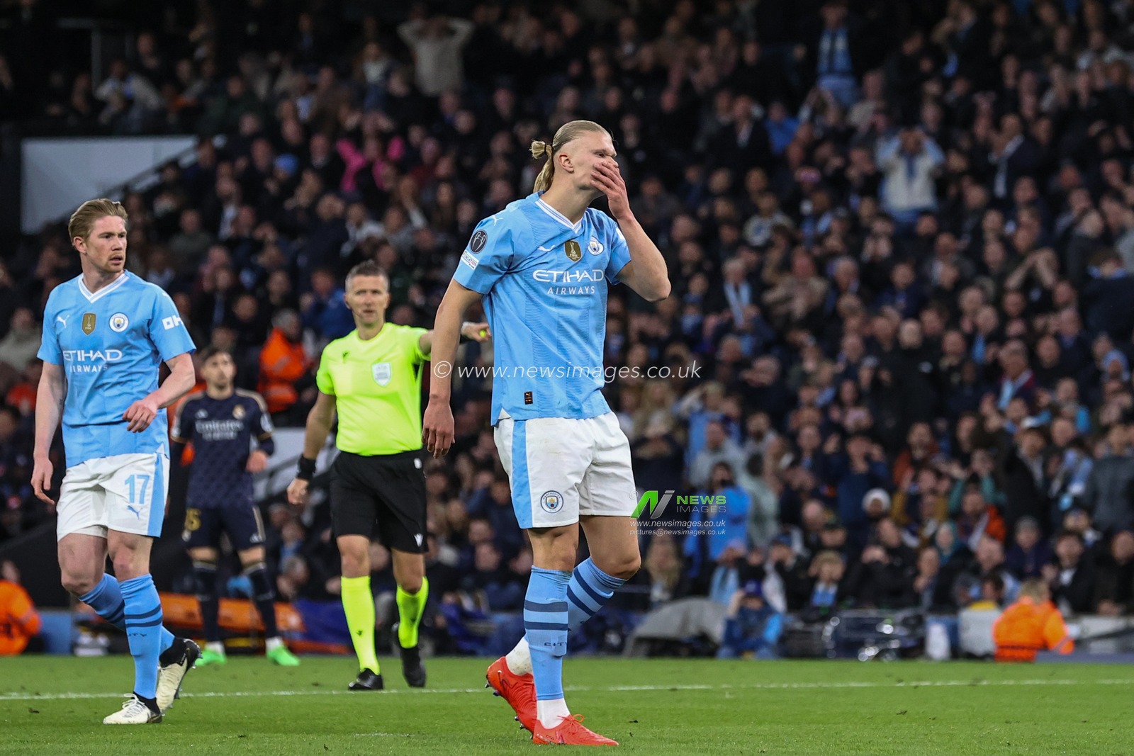 Erling Haaland of Manchester City reacts after he misses a chance on goal during the UEFA Champions League Quarter Final Manchester City vs Real Madrid at Etihad Stadium, Manchester, United Kingdom, 17th April 2024

(Photo by Mark Cosgrove/News Images)