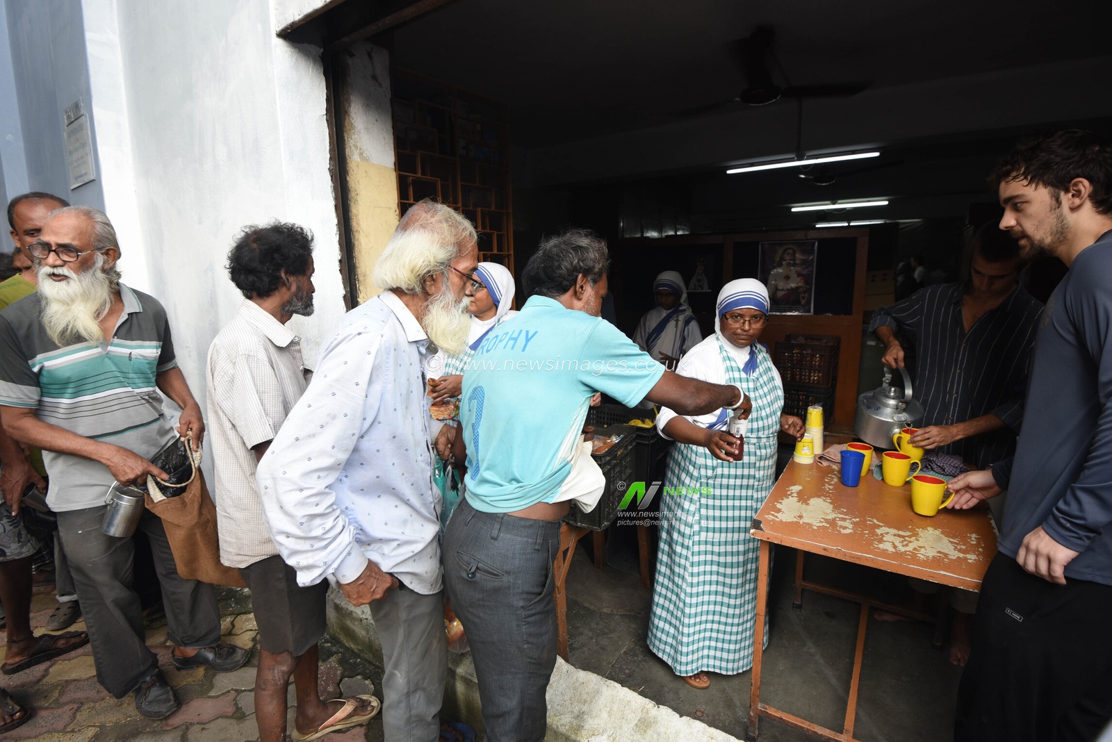 Nuns of the Missionaries of Charity, the order founded by Saint Teresa of Calcutta, distribute free meals to underprivileged people on the saint’s 116th birth anniversary in Kolkata, India, Wednesday, August 26, 2026. Photo by Debajyoti Chakraborty.(Photo: Debajyoti Chakraborty/News Images)