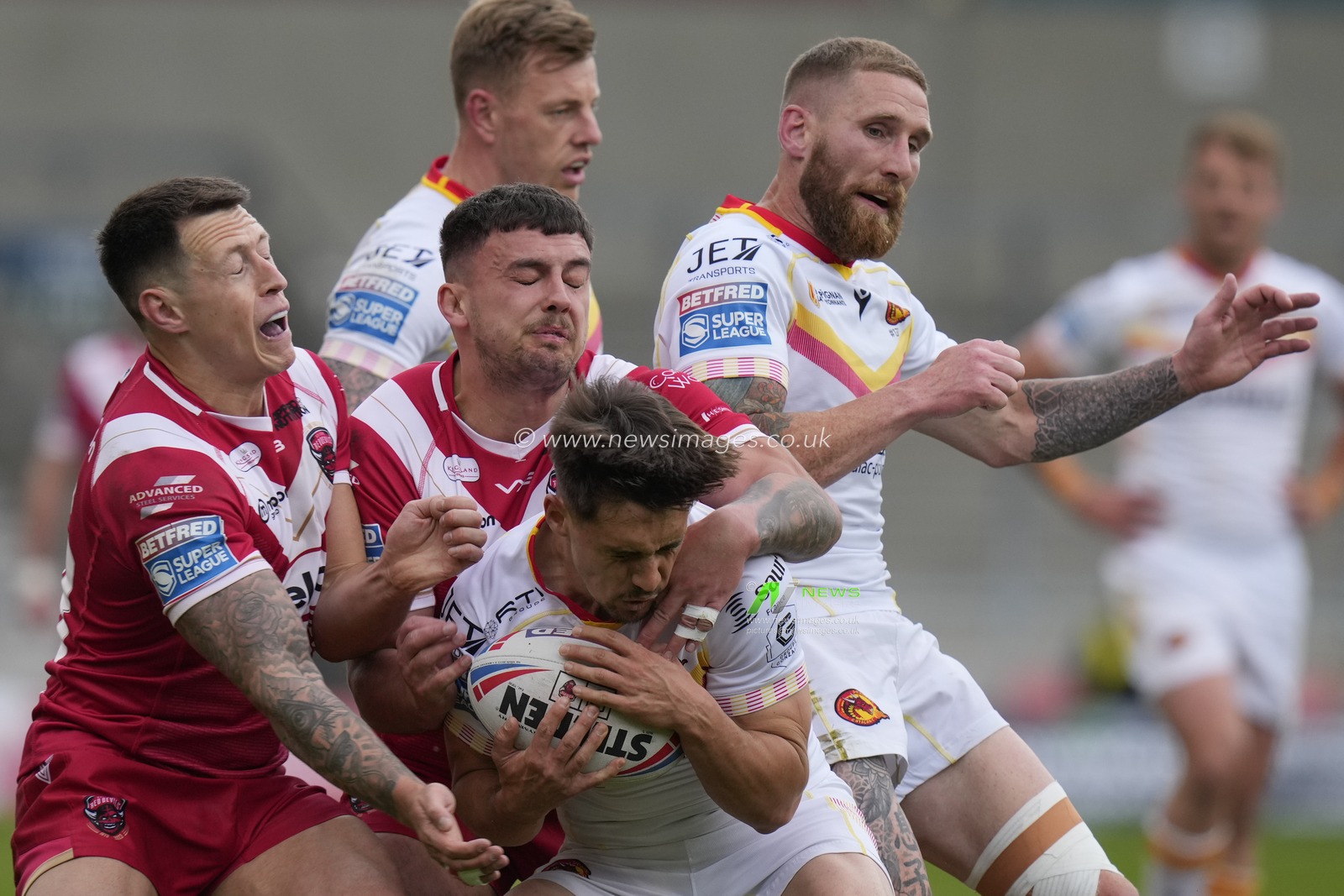Deon Cross #28 and Oliver Partington #13 of Salford Red Devils tackle Arthur Mourgue #1 of Catalans Dragons during the Betfred Super League Round 10 match Salford Red Devils vs Catalans Dragons at AJ Bell Stadium, Eccles, United Kingdom, 23rd April 2023

(Photo by Steve Flynn/News Images)