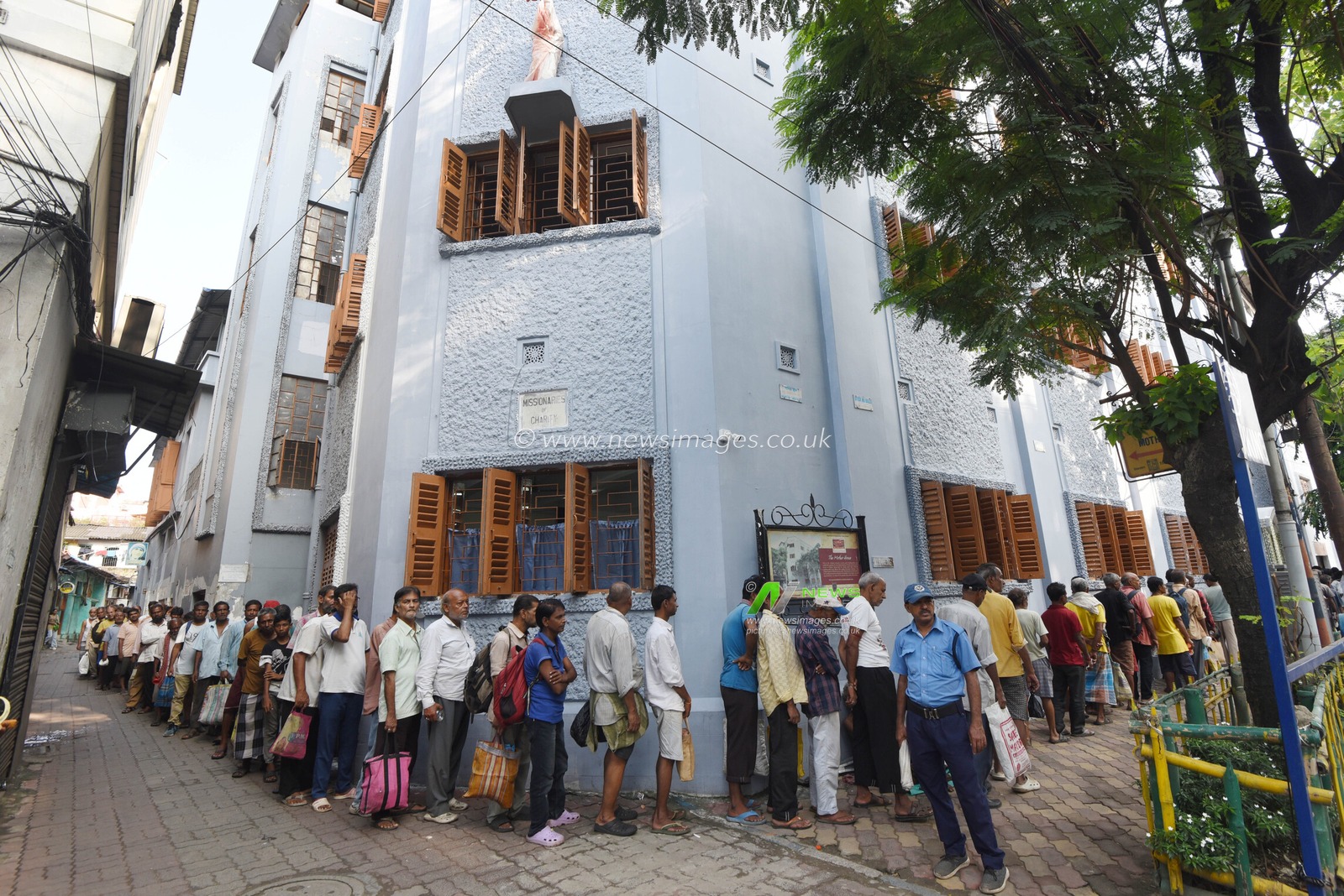 People from underprivileged communities wait for free meals outside the Missionaries of Charity on Saint Teresa of Calcutta’s 116th birth anniversary in Kolkata, India, Wednesday, August 26, 2026. Photo by Debajyoti Chakraborty.(Photo: Debajyoti Chakraborty/News Images)