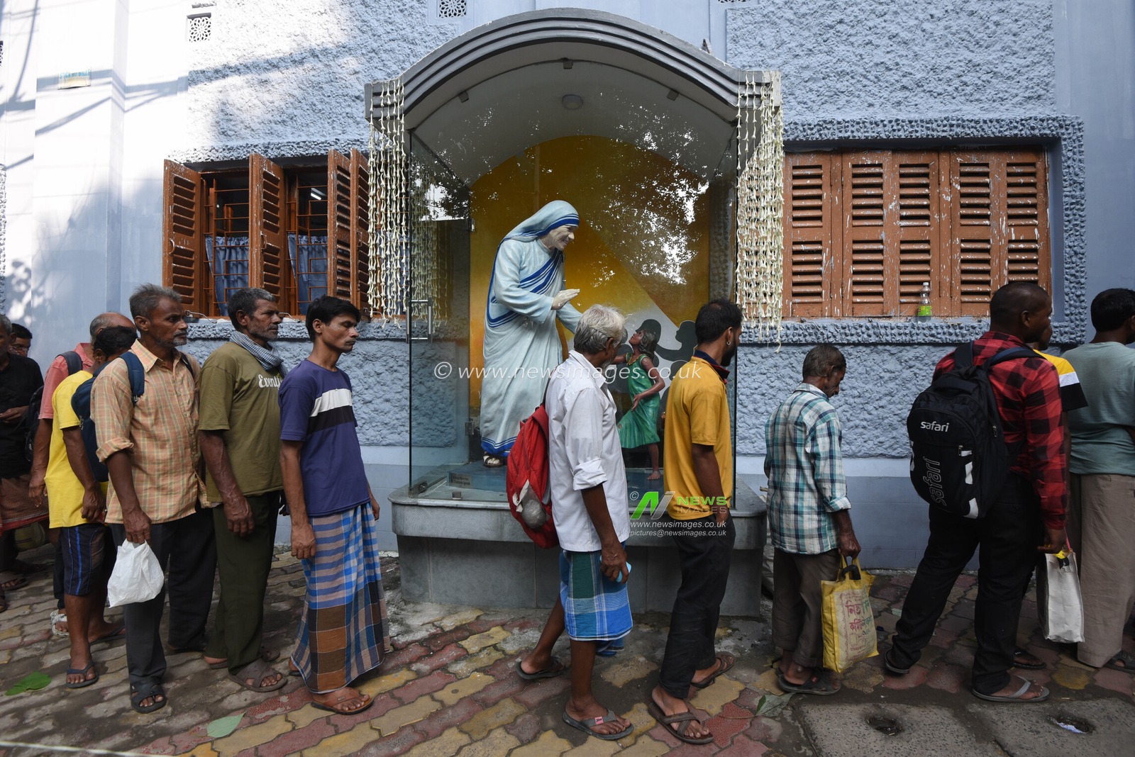 People from underprivileged communities wait for free meals outside the Missionaries of Charity on Saint Teresa of Calcutta’s 116th birth anniversary in Kolkata, India, Wednesday, August 26, 2026. Photo by Debajyoti Chakraborty.(Photo: Debajyoti Chakraborty/News Images)
